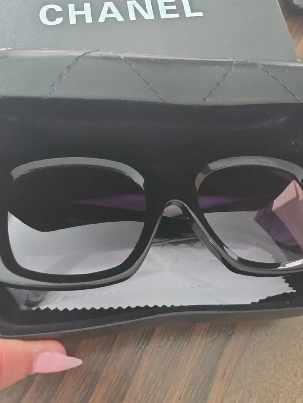 CHANEL Black Frame Sunglasses with Gold Accents and Gradient Purple Lenses